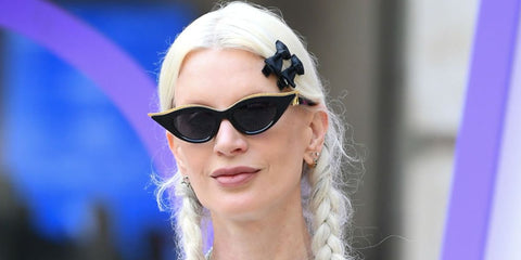 Supermodel Kristen McMenamy was seen wearing black and gold Valentino V-GOLDCUT-II VLS 114A sunglasses at the 2023 Royal Academy of Arts Summer Preview Party in London. Shop online now on Pretavoir