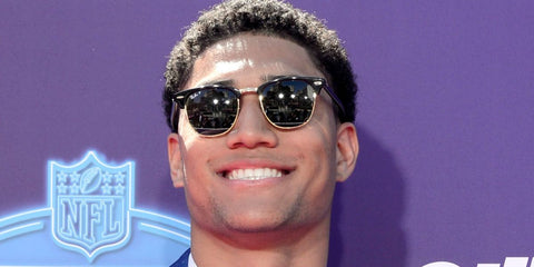 American football player Kyle Hamilton of Baltimore Ravens was seen wearing the iconic black Ray-Ban Clubmaster RB 3016 901/58 Polarised sunglasses at the NFL Draft 2022 in Las Vegas.