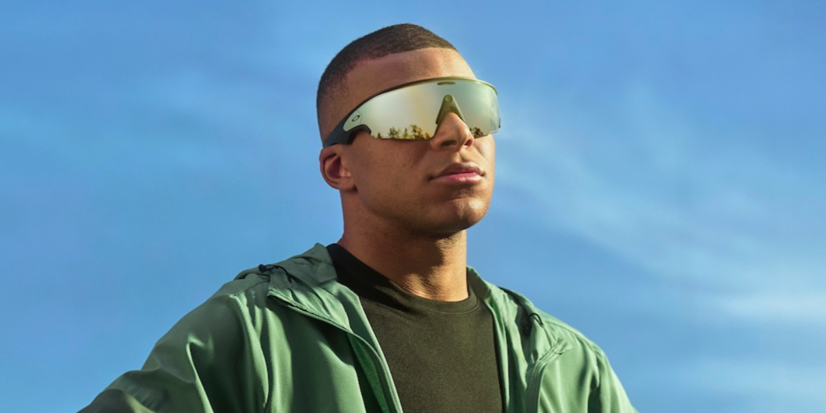 Kylian Mbappe was seen wearing black Oakley Meta Vanguard OW8001 04 with 24k Prizm lenses Smart Glasses in the Oakley Meta campaign.