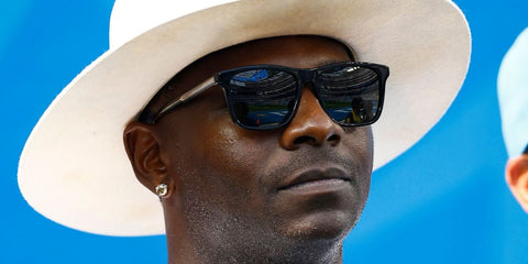 American football athlete LaDainian Tomlinson was seen wearing Gucci GG0381SN 007 Polarised Black and Crystal sunglasses at SoFi Stadium, September 2023. Shop online now on Pretavoir