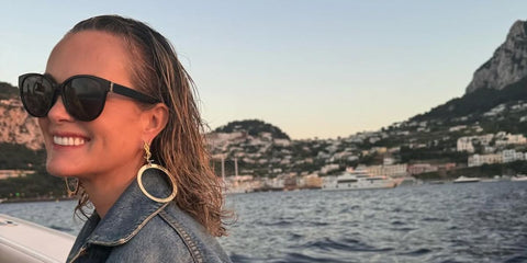 French modal and philanthropist Laeticia Hallyday was seen wearing black Saint Laurent Sun SL M107 001 round sunglasses in her Instagram post