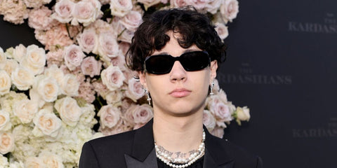 Son of Travis Barker, Landon Barker was seen wearing black Prada PR 17WS 1AB5S0 Symbole Sunglasses at the Los Angeles premiere of "The Kardashians". Shop online now on Pretavoir