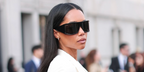 Laura Harrier was seen wearing black Gucci GG2274S 001 shield sunglasses at the Gucci Fall/Winter 2026 fashion show during Milan Fashion Week.