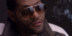 Laurence Fishburne was seen wearing Porsche Design 8478 A Gold Frame sunglasses with Brown + Blue Lenses in action movie Deep Cover