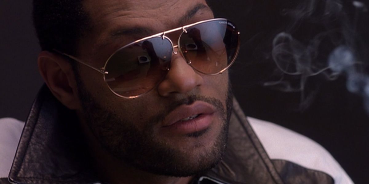 Laurence Fishburne was seen wearing Porsche Design 8478 A Gold Frame sunglasses with Brown + Blue Lenses in action movie Deep Cover