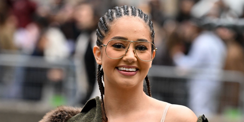 French influencer Lena Situations was seen wearing gold Miu Miu MU A56S 5AK08N Blue Control sunglasses at the Miu Miu Spring/Summer 2026 fashion show during Paris Fashion Week. Shop online now on Pretavoir