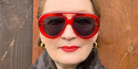 Actress Lesley Manville was seen wearing red Loewe Curvy LW40144U 66A aviator sunglasses in the Loewe Fall/Winter 2024 Pre=Collection campaign.