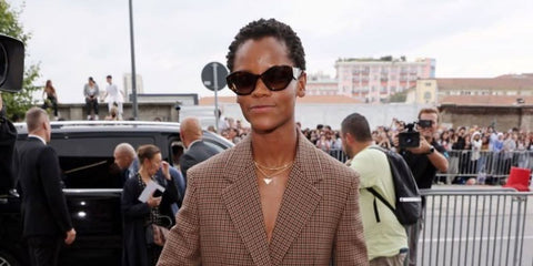 Letitia Wright wears Prada PR A09S 16N5Y1 sunglasses to the brand's Spring/Summer 2024 fashion show in Milan