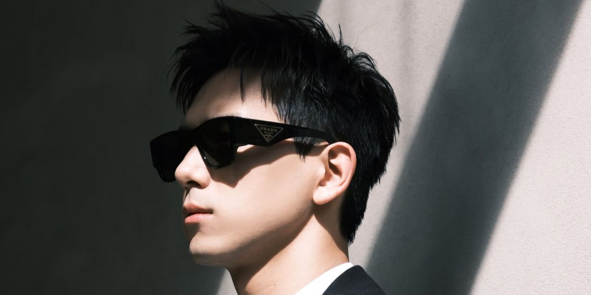 Chinese actor Li Xian was seen wearing black Prada PR 10ZS 1AB5S0 sunglasses at the Prada Menswear Spring/Summer 2024 fashion show during Milan Men's Fshion Week. Shop online now on Pretavoir