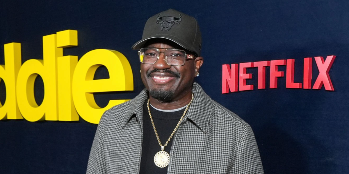 Comedian and actor Lil Rel Howery was seen wearing gold Versace 1308 1002 square optical glasses at the premiere of Netflix's "Being Eddie" in Los Angeles, November 2025.