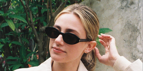 Lili Reinhart was seen wearing black Saint Laurent Sun SL 567 001 sunglasses in her Instagram post, May 2025.