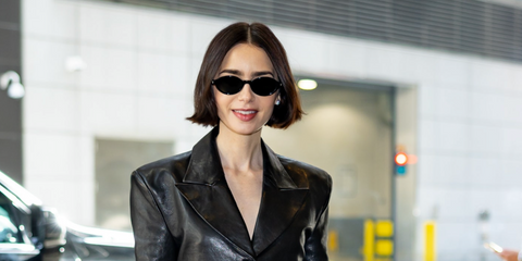 Lily Collins wears Saint Laurent Sun SL 751 Jeanne 001 sunglasses in New York City