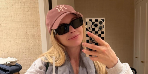 Lindsay Lohan was seen wearing black Prada PR 27ZS 16K08Z sunglasses in her Instagram selfie, April 2026.