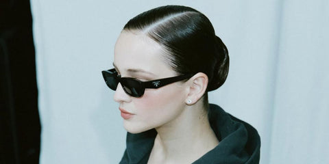 German actress Lisa Vicari was seen wearing black Prada PR B06S 16K08Z sunglasses at The Sound of Prada event in Berlin, June 2025.