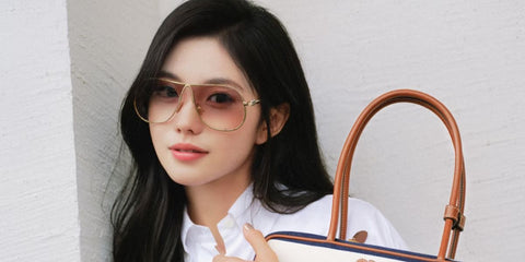 Chinese actress Liu Haocun was seen wearing gold Miu Miu MU A56S 5AK90L sunglasses with brown gradient lenses in a social media post, July 2025.