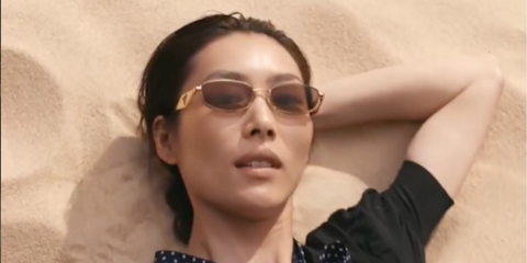 Liu Wen was seen wearing gold Prada PR D51S 5AK20I sunglasses in the Prada Days Spring/Summer 2026 campaign.