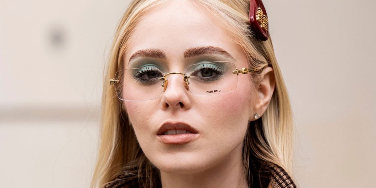 Mexican actress Loreto Peralta was seen wearing gold Miu Miu MU 50YV 5AK1O1 rimless optical glasses at the Miu Miu Spring/Summer 2026 fashion show during Paris Fashion Week.