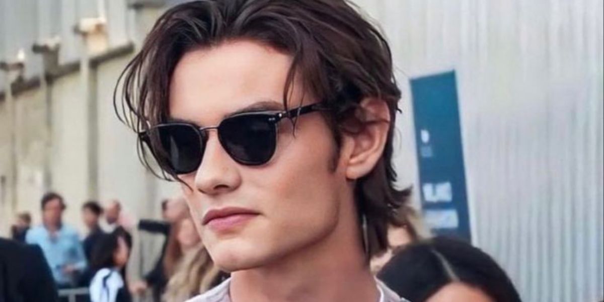 Louis Partridge is seen wearing Prada PR 17YS 1AB03R Polarised sunglasses to attend the brand's Sprig/Summer 2024 fashion show in Milan
