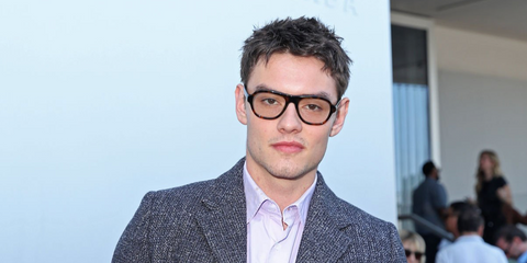 Louis Partridge was seen wearing tortoise Prada PR C12V 20D1O1 optical glasses at the Prada Menswear Spring/Summer 2027 fashion show during Milan Men's Fashion Week.