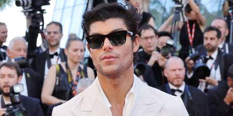 Brazilian television host and internet personality Lucas Castellani was seen wearing black Ray-Ban Wayfarer Reverse RB R0502S 6677/VR sunglasses at the Cannes Film Festival 2025.