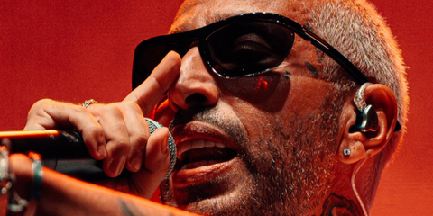 Italian rapper Luche was seen wearing black Bottega Veneta BV1348S 001 sunglasses at his concert in Puglia, August 2025.