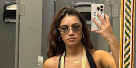New Zealand actress Luciane Buchanan was seen wearing Miu Miu MU A51S 5AK50K sunglasses with light grey lenses at a Bad Bunny concert in Puerto Rico, shared through her Instagram post in September 2025.