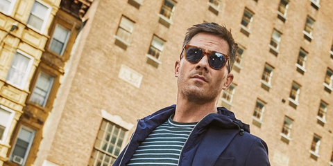 Actor Luke Macfarlane was seen wearing brown Persol 3226S 96/56 sunglasses with blue lenses in a Men's Health Magazine feature. Shop online now on Pretavoir