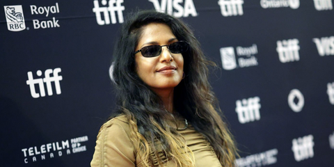 Rapper M.I.A. was seen wearing black Prada PR B54S 1AB5Z1 Polarised rectangular sunglasses at the Toronto International Film Festival 2025. Shop online now on Pretavoir