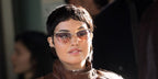 Singer Mabel was seen wearing gold Chloe CH0386S 004 Uma cat eye sunglasses with brown to orange gradient lenses at the Chloe Fall/Winter 2026 fashion show during Paris Fashion Week.