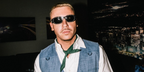 Macklemore was seen wearing black Versace 4361 5397/87 "Biggie" sunglasses with studded details at his Seattle concert, October 2023