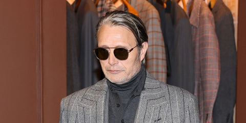 Actor and brand ambassador Mads Mikkelsen was seen wearing matte brown Zegna EZ0290 49E sunglasses at the Zegna Fall/Winter 2026 fashion show during Milan Men's Fashion Week.