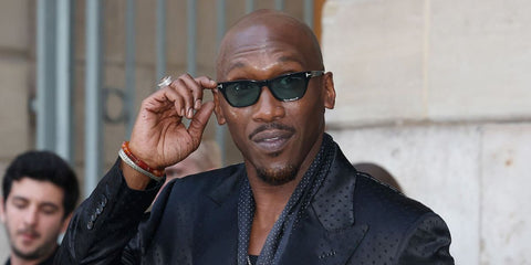 Mahershala Ali was seen wearing black Tom Ford Penn-02 TF1362 01V sunglasses with light blue lenses at the Tom Ford Spring/Summer 2026 fashion show during Paris Fashion Week. Shop online now on Pretavoir