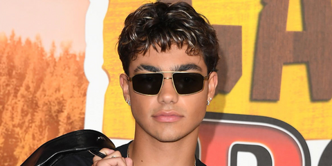 Actor Malachi Barton was seen wearing gold Prada PR A57S 5AK90F sunglasses with light brown lenses at the Los Angeles premiere of "Camp Rock 3".