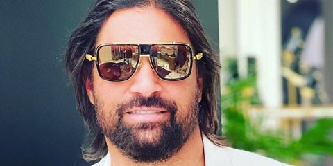 New Zealand actor Manu Bennett was seen wearing black and gold Balmain O.R. BPS-104A sunglasses in Miami, shared through his Instagram post in March 2023.