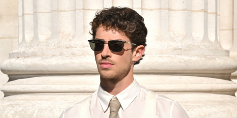 Manu Rios was seen wearing tortoiseshell and gold Saint Laurent Sun SL 795 Joe 001 sunglasses at the Saint Laurent Menswear Spring/Summer 2026 fashion show during Paris Fashion Week. Shop online now on Pretavoir