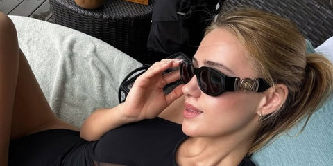 Bulgarian actress Maria Bakalova was seen wearing black Versace 4361 GB1/87 Medusa Biggie Sunglasses in Bali, shared through her Instagram post in December 2025.