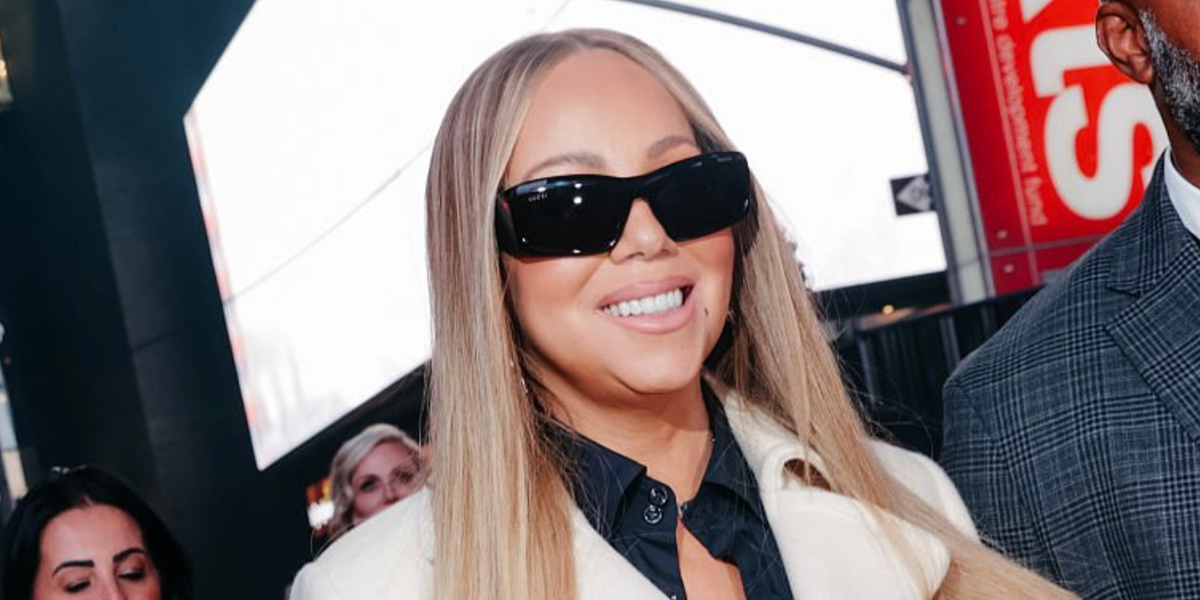 Mariah Carey was seen wearing black Gucci GG2273S 001 sunglasses at the Gucci Cruise 2027 fashion show in Times Square, New York City.