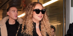 Mariah Carey was seen wearing black Saint Laurent Sun SL M95/K 001 sunglasses at the Milan airport, ahead of the Milano-Cortina Olympic games where she is set to perform at the opening ceremony, February 2026