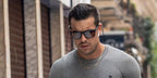 Mario Casas wears Oakley Holbrook XL OO9417 35 Prizm sunglasses while working out