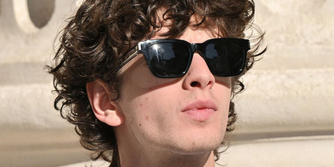 Russian actor and lead cast of Anora, Mark Eydelshteyn, was seen wearing black Saint Laurent Sun SL 790 001 square sunglasses at the Saint Laurent Menswear Spring/Summer 2026 fashion show during Paris Men's Fashion Week. Shop online now on Pretavoir