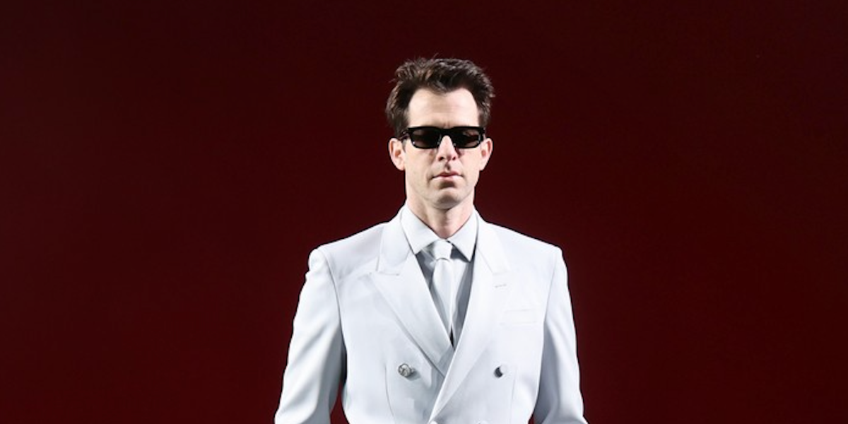 Mark Ronson wears Gucci GG1539S 001 sunglasses to the brand's Fall/Winter 2024 fashion show in Milan