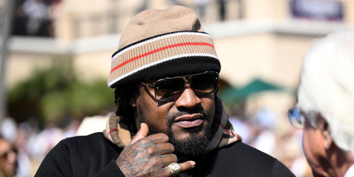 Former American football player Marshawn Lynch was seen wearing Dita Mach Six DTS 121 03 Black Iron and Black Rhodium sunglasses with brown gradient lenses at the 2025 Breeders' Cup World Championships in California, November 2025