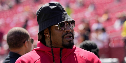 Former American football player Marshawn Lynch was seen wearing white  and gold Dita Mach Six DTS 121 07 sunglasses at the NFL Preseason 2025 game between Baltimore Ravens and Washington Commanders in Maryland, August 2025.