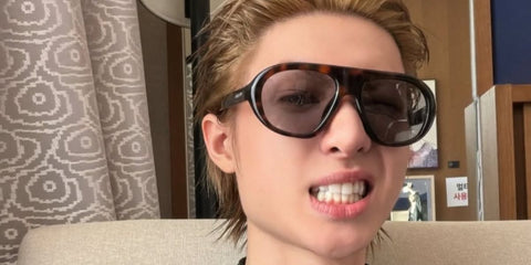 South Korean singer Martin of K-Pop group CORTIS was seen wearing juniper tortoise Prada PR C05S 20D50Q sunglasses with grey lenses in March 2026.