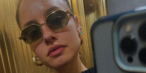 Italian actress Matilde Gioli was seen wearing gold Prada PR A51S 15N01T hexagonal sunglasses in her Instagram mirror selfie post
