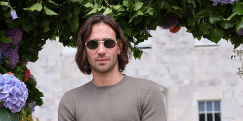 Maxim Baldry was seen wearing gold and brown real wood Cartier CT0464S 006 round sunglasses at Cartier Style Et Luxe at the Goodwood Festival of Speed in Chichester, England, July 2024