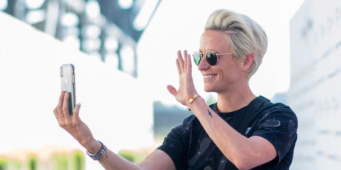 Megan Rapinoe wears Ray-Ban Round Metal 3447 001 sunglasses