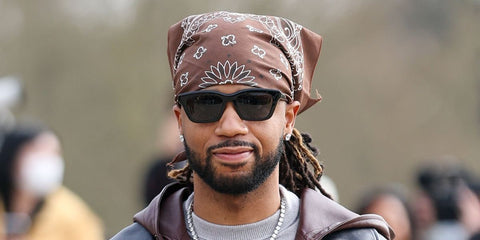 Hip-hop producer Metro Boomin was seen wearing black Loewe Slim LW40177I 01A sunglasses at the Loewe Fall/Winter 2026 fashion show during Paris Fashion Week.