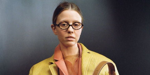 Mia Goth modeled Miu Miu MU 04ZS VAU08N Blue Control glasses for the brand's Fall/Winter 2022 campaign