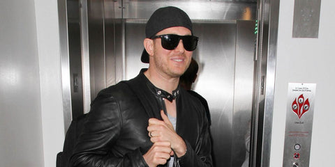 Michael Buble was seen wearing black Ray-Ban 4147 601/58 Polarised sunglasses at Los Angeles International Airport